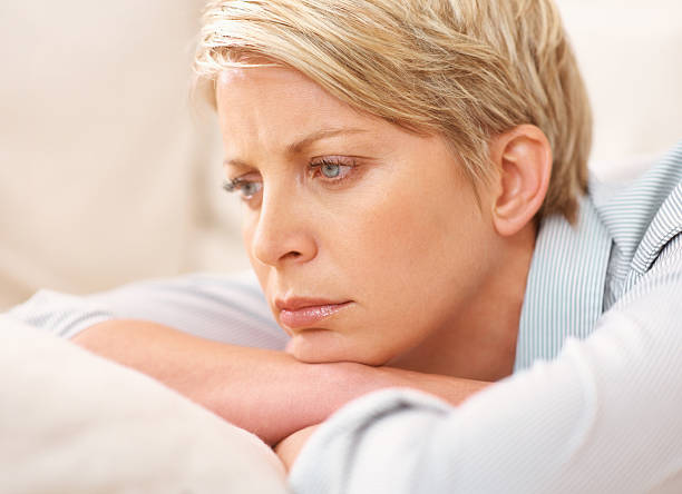 Woman lying on the couch day dreaming