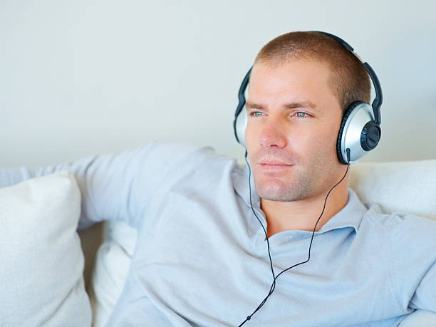 istock Handsome young guy listening to music 95854573