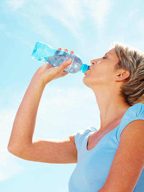 istock Mid adult woman drinking water 95854577