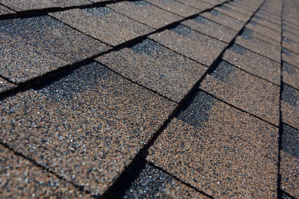 istock Close up view on asphalt roofing shingles background. 958546754