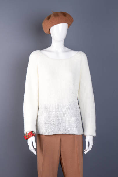 istock Female mannequin dressed in sweater and trousers. 958547068