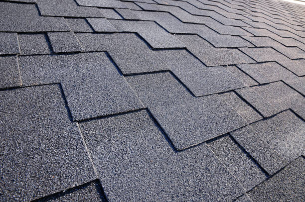 istock Close up view on asphalt roofing shingles 958547134