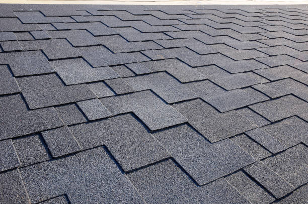 istock Close up view on asphalt roofing shingles 958547158