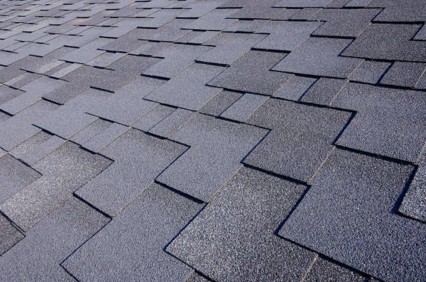 istock Close up view on asphalt roofing shingles 958547174