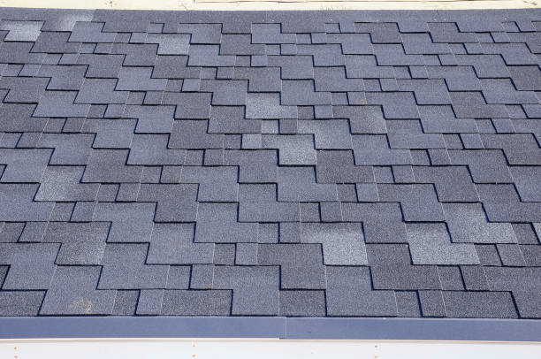 istock Close up view on asphalt roofing shingles 958547234