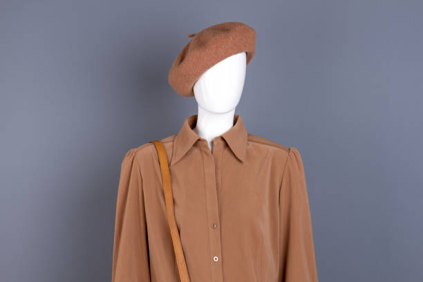istock Mannequin in brown shirt and beret. 958550260