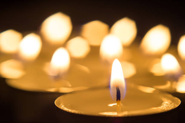 istock Many burning candles with shallow depth of field 958550824
