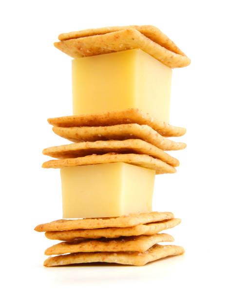 istock Delicious crackers with cheese on white background 958551078