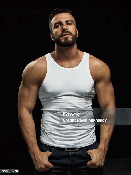 A Strong A Serious Muscular Man Stock Photo - Download Image Now - Men, Sensuality, Sex Symbol