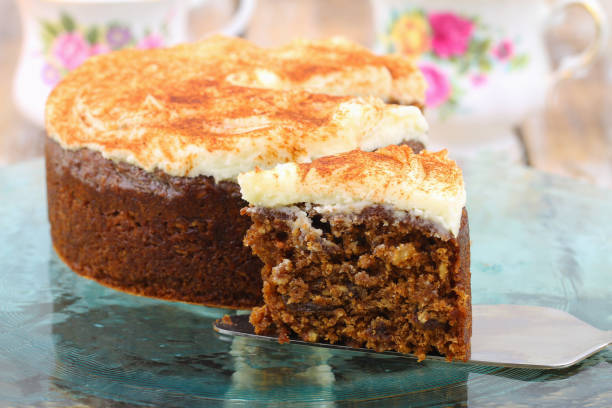 istock Slice of delicious carrot cake with walnuts with marzipan icing 958552194