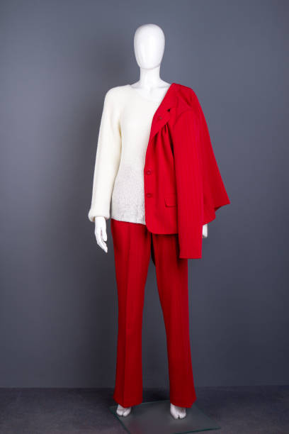 istock Mannequin with red female suit and white sweater. 958562234