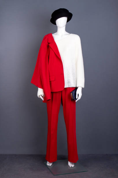 istock Mannequin in black hat and red suit. 958562388