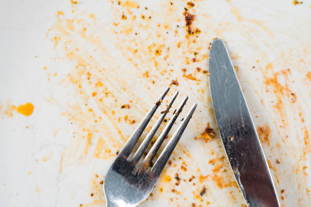 istock Dirty plate with fork and knife cutlery after dinner. 958562834