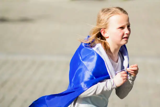 Photo of happy young blonde girl demonstrator sporting the European flag