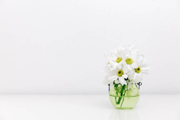 istock Spring flowers in vase. Minimalistic bright background 958565918
