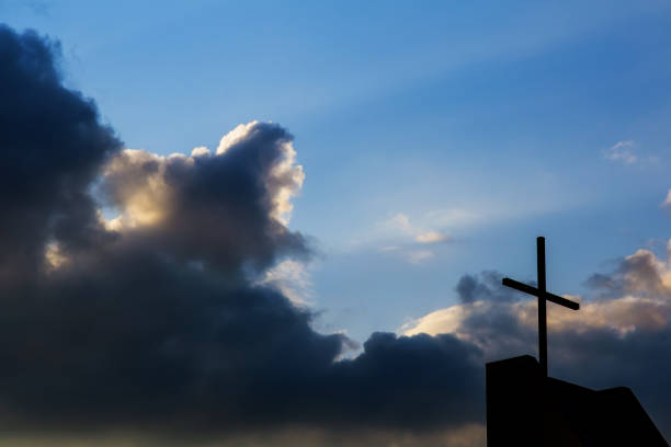 istock Cross against the sky background. Religious concept 958566214