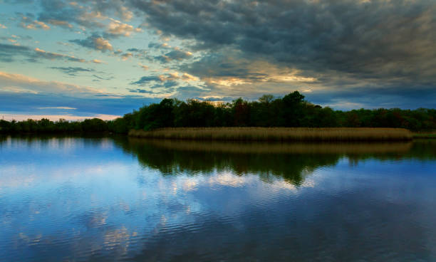 istock Beautiful Morning Multicolored scene sunset reflected in the lake. 958566342