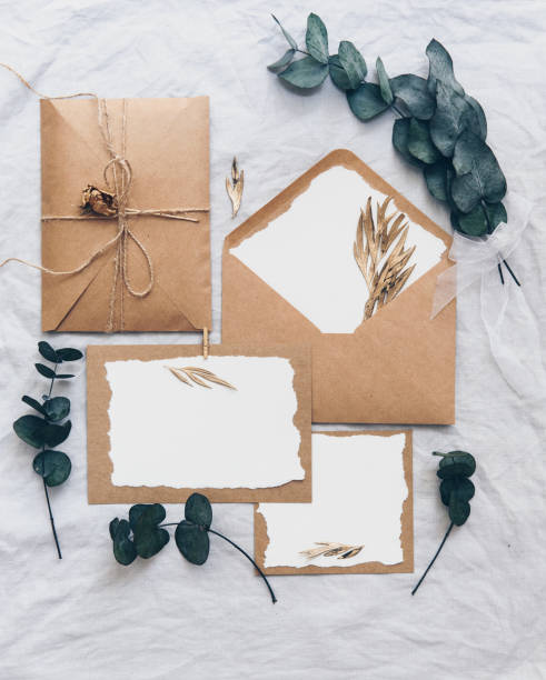 istock Mock up creative wedding invitation set with eucalyptus branch  on linen background 958569280