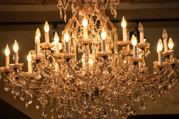istock Lighted large crystal chandelier hanging from ceiling 958569610