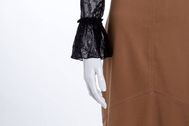 istock Close up mannequin hand and skirt. 958571990