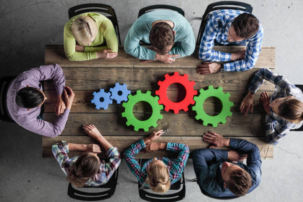 istock Business people with cogs of business 958572774