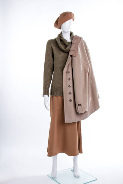 istock Female beret and coat on mannequin. 958572944