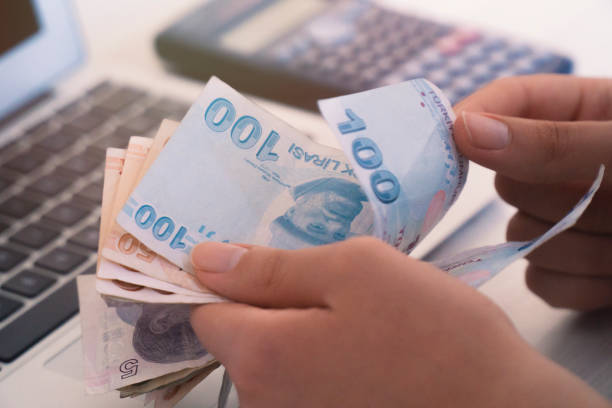 istock turkish lira count, computer and calculator unknown person 958573528
