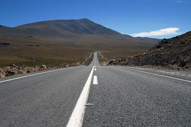 Infinite road in the desert stock photo