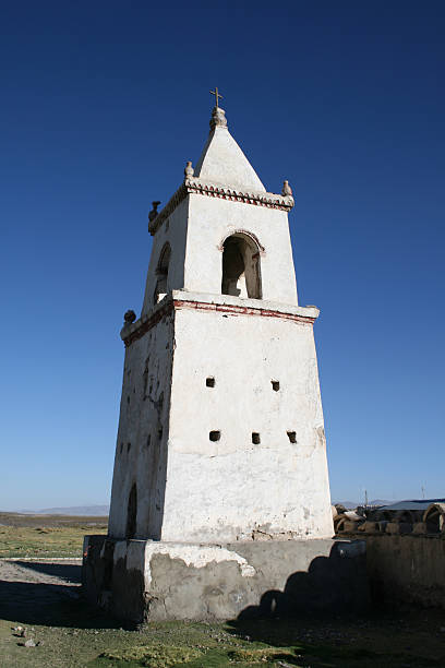 Ancient altiplano Church in Chile towards a crisp blue sky stock photo