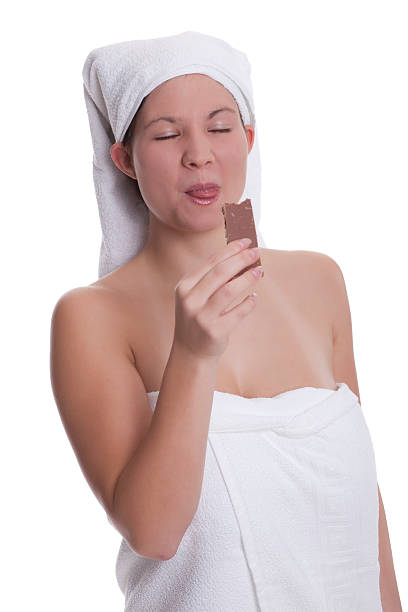 istock Beautiful young woman eating chocolate 95857913