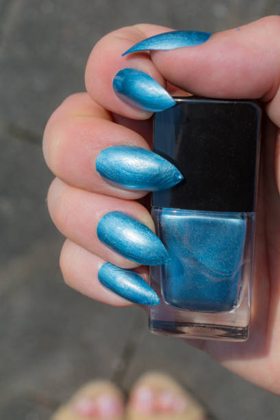 istock Just painted Baby blue nails showing with the square bottle 958580302