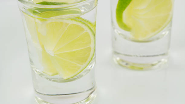 istock Two shots of vodka or tequila with lime 958580644
