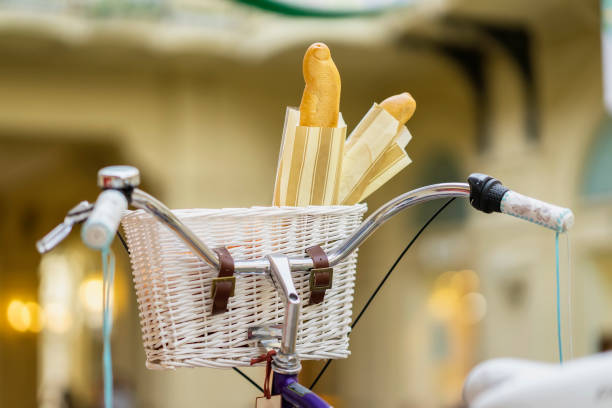 Vintage bicycle close-up and basket with fresh french breads