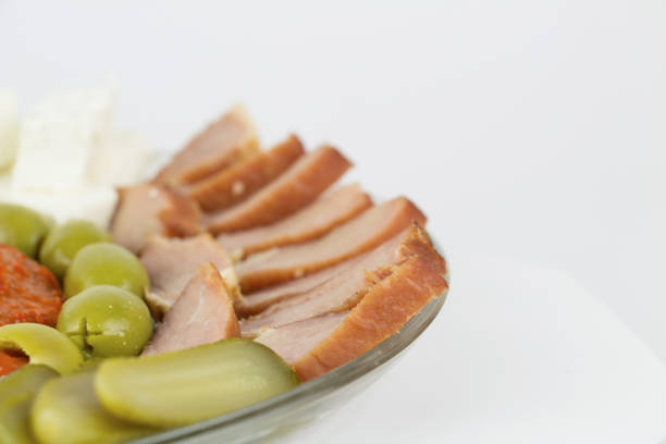 raw pork on plate over white background