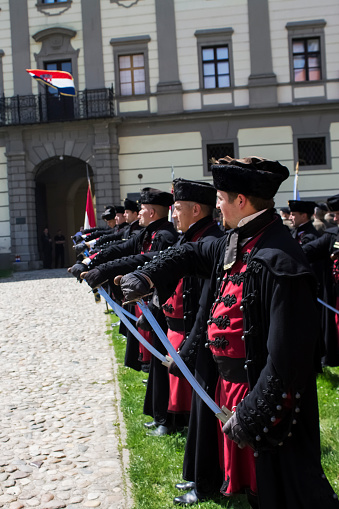 Cakovec, Croatia - April 28, 2018 : Zrinski guards with a black,traditional military uniform pulling out swords on fest \