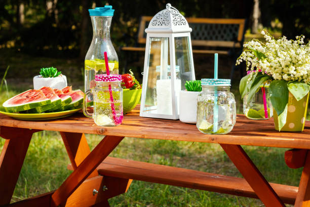 istock picnic table with fruit and lemonade in a summer park 958599680