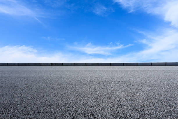 istock new asphalt road and sky clouds 958600544