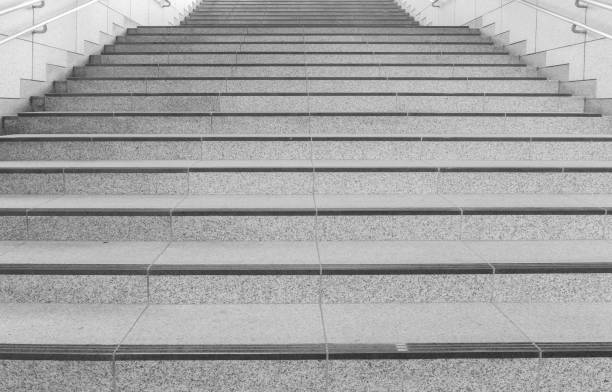 istock Concrete staircase with metallic handrail at modern buiding 958600718
