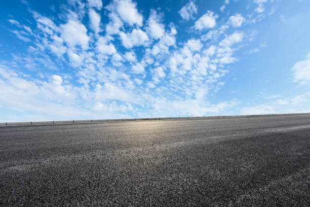 istock new asphalt road and sky clouds 958600904