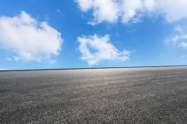istock new asphalt road and sky clouds 958601046