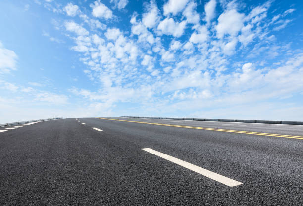 istock new asphalt road and sky clouds 958603380
