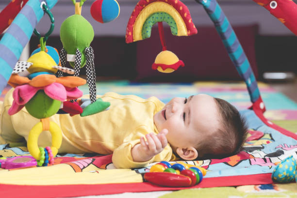 istock Sweet Baby Playing With Toys 958603460