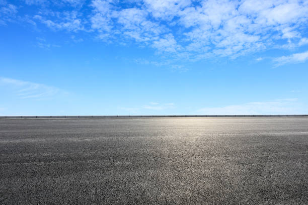 istock new asphalt road and sky clouds 958603818