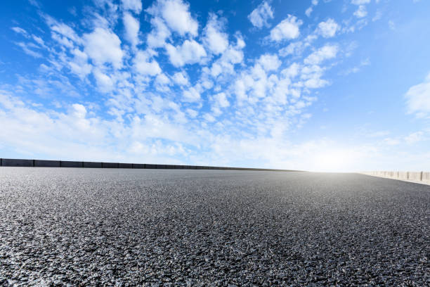 istock new asphalt road and sky clouds 958603820
