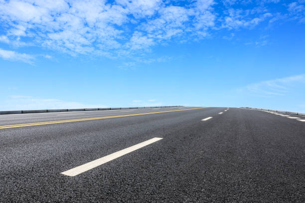 istock new asphalt road and sky clouds 958604224