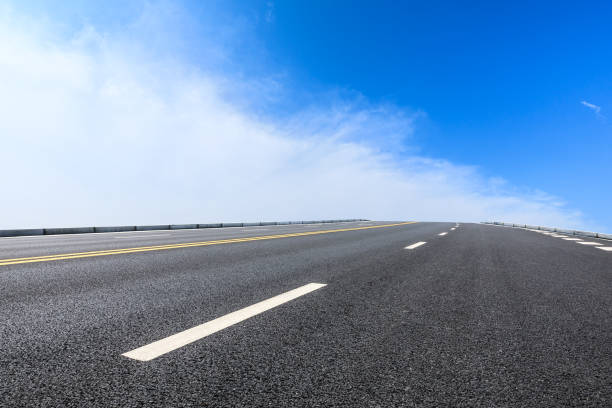 istock new asphalt road and sky clouds 958604228