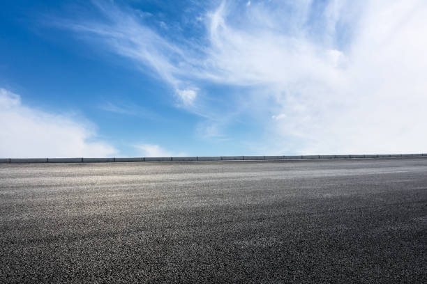 istock new asphalt road and sky clouds 958604410