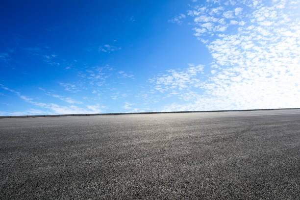 istock new asphalt road and sky clouds 958606832