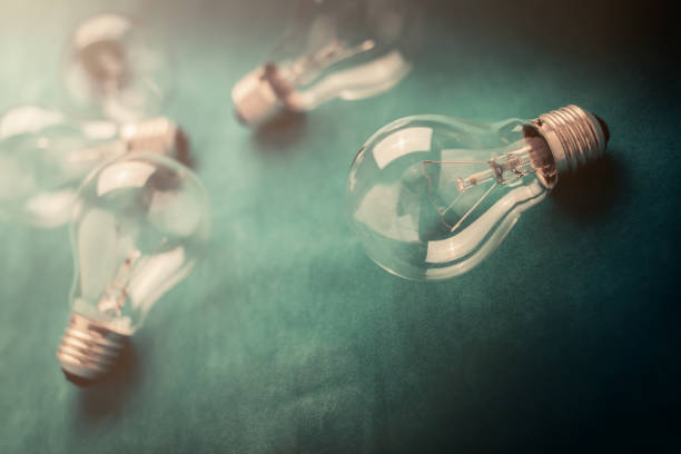 istock light bulb on color fabric background creativity ideas concept 958606938