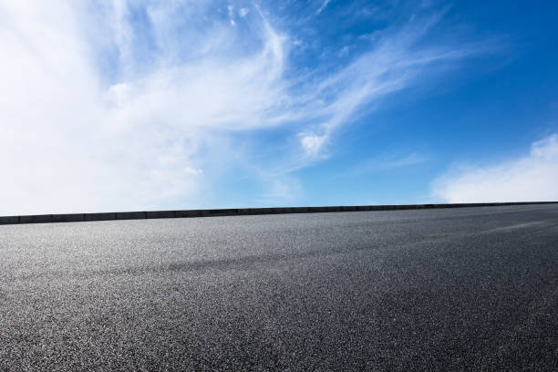 istock new asphalt road and sky clouds 958607220